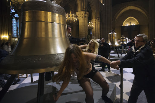FRANCE, Paris : Activists from the women&rsquo;s rights organisation Femen protest in Notre-Dame de Paris Cathedral in Paris February 12, 2013
