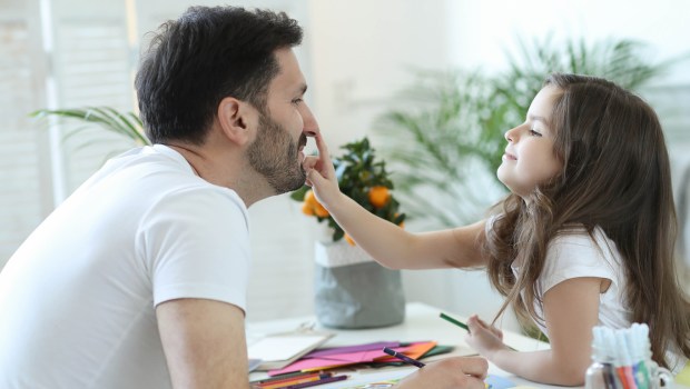 FATHER AND DAUGHTER LAUGHING