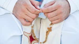 PRAY; ROSARY; PRIEST; HANDS