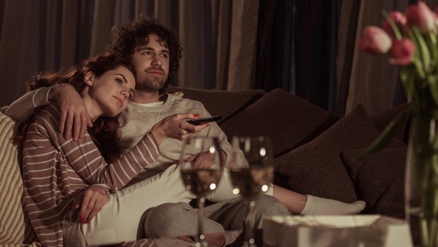 A COUPLE WATCHING TV