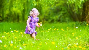 LITTLE GIRL PLAYING GARDEN