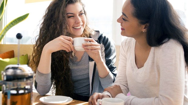 WOMEN CHATTING OVER COFFEE