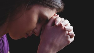 WOMAN PRAYING