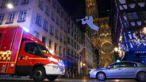 STRASBOURG ATTACKAn emergency medical response vehicle passes by the cathedral in Strasbourg, after a shooting breakout, on December 11, 2018. - A gunman killed at least three people and seriously injured another 11 near the famed Christmas market in the French city of Strasbourg before fleeing the scene, security officials said. Police launched a manhunt after the killer opened fire at around 7pm local time (1800 GMT), sending crowds of evening shoppers fleeing for safety. (Photo by SEBASTIEN BOZON / AFP)
