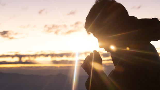 christian man hand praying