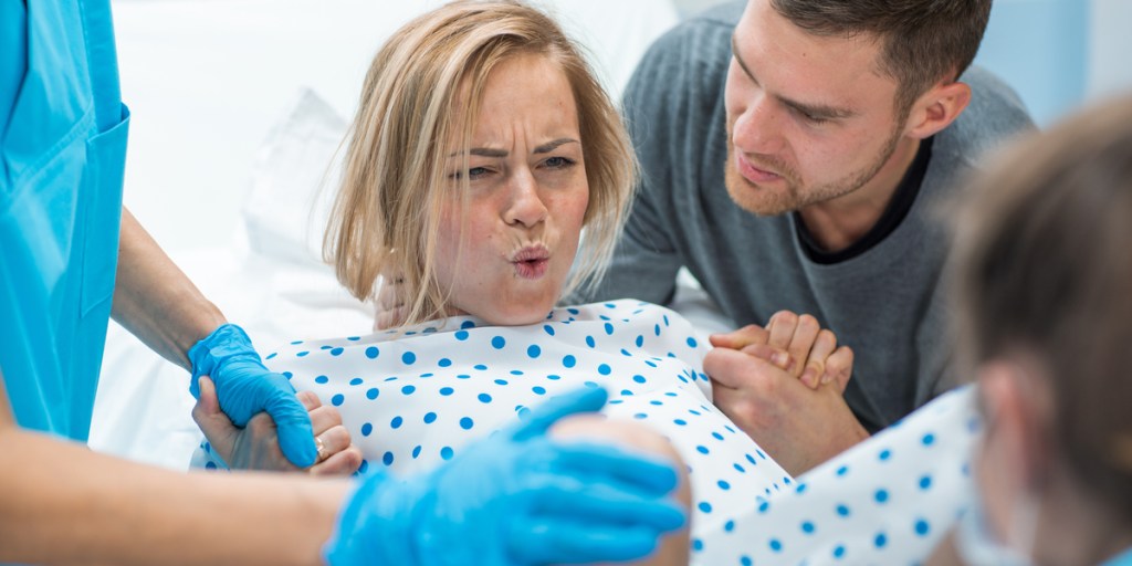 woman in labor with husband