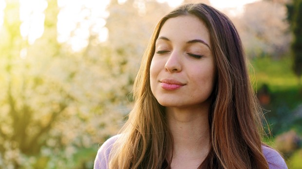 web3-peace-woman-light-closed-eyes-shutterstock_1356862022.jpg