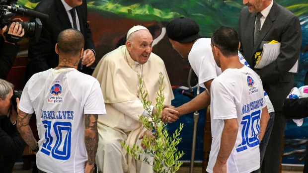 Pope-Francis-wheelchair-greets-Brazilian-footballer-Ronaldinho-and-Dani-Alves-and-Argentinian-footballer-Maxi-Rodriguez-AFP