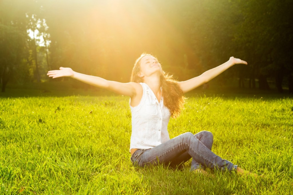 young woman with outstretched arms