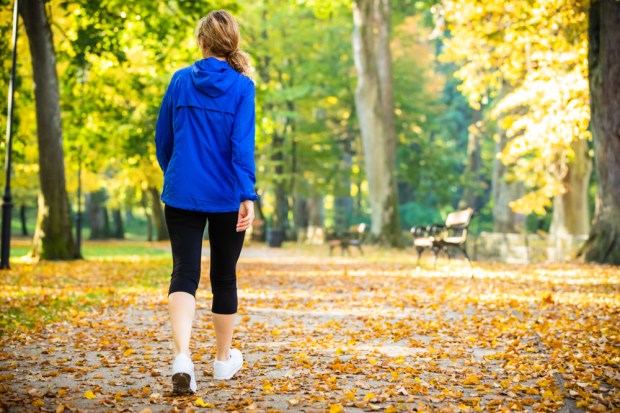 woman walking in city park