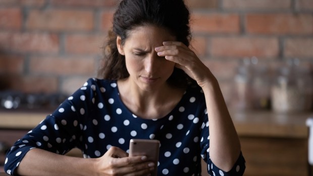 woman having problems with mobile phone