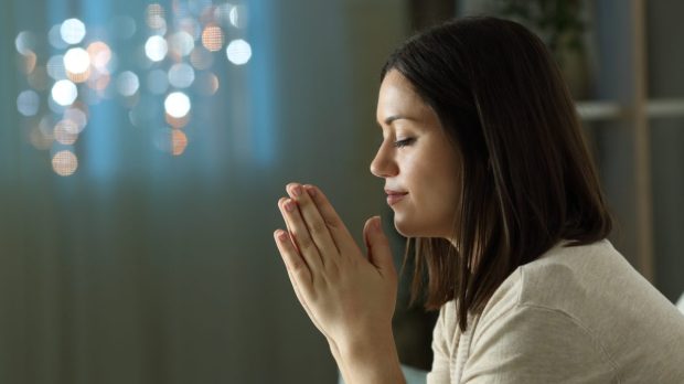 PRAY-WOMAN-CHURCH-shutterstock_1822640993-e1686221597843.jpg