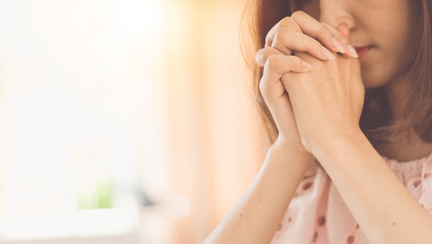 PRAY-WOMAN-shutterstock_1152329135.jpg