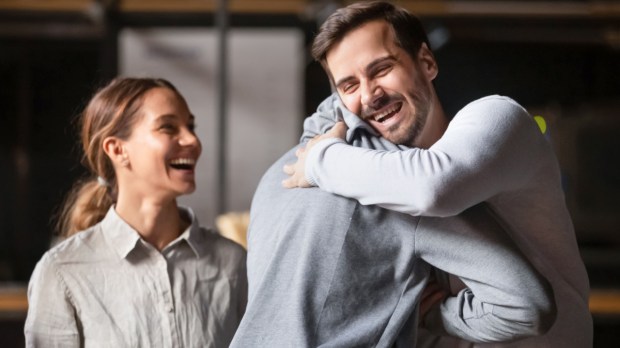 Friends hug happy Shutterstock