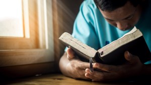 man praying at home