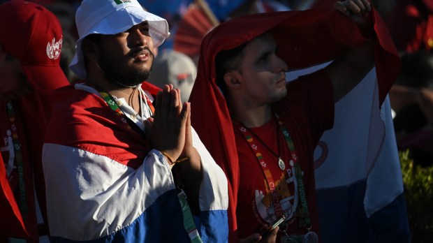 French pilgrims attend the Stations of the Cross ceremony presided over by Pope Francis in Edward VII Park