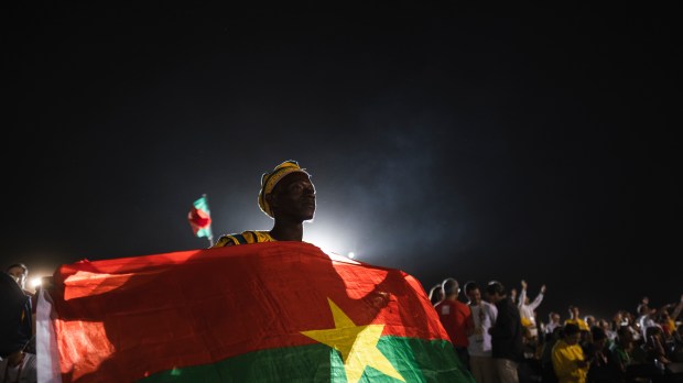 Pilgrims pray during the World Youth Days vigil with young people in Tejo Park, Lisbon