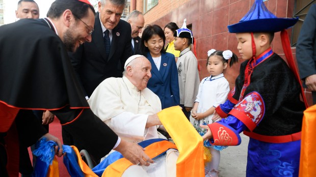 children greeting Pope Francis upon his arrival at the Apostolic Prefecture of Ulaanbaatar