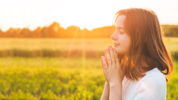 PRAY-OUTSIDE-GIRL-shutterstock_1438888781