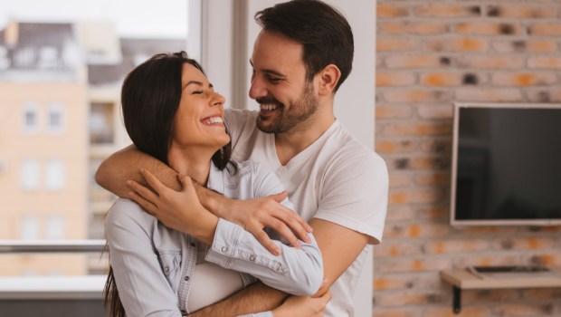 Beautiful couple hugging and looking at each other