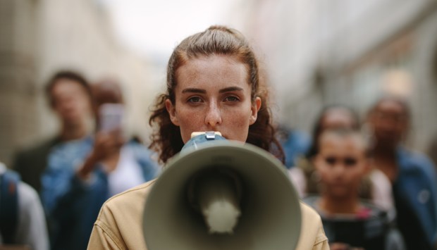 PROTEST-WOMAN-shutterstock_1768715813