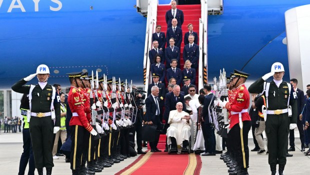 Pope Francis is greeted during his arrival at Jakarta Soekarno-Hatta International Airport on September 3, 2024.